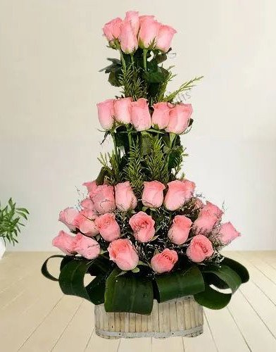 Beautiful Basket of Pink Roses with Leaves