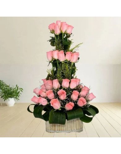 Beautiful Basket of Pink Roses with Leaves