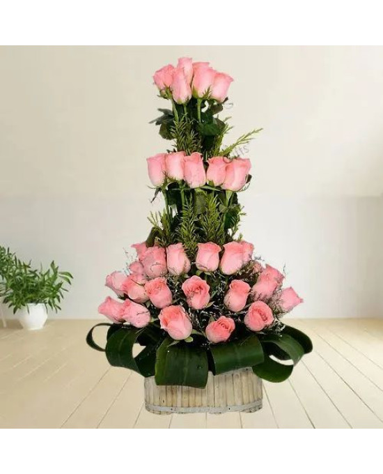 Beautiful Basket of Pink Roses with Leaves