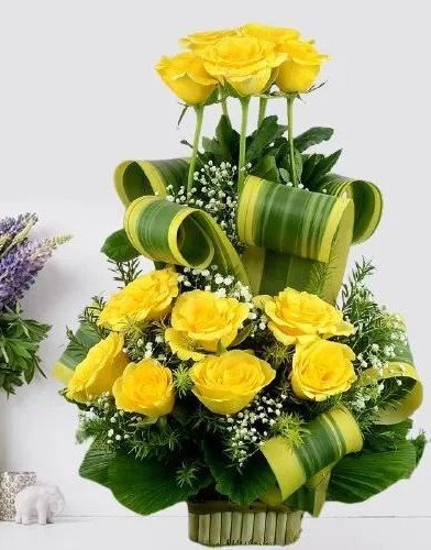 Mesmerizing Basket of Yellow Roses with Greens