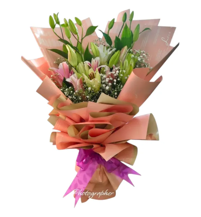 Premium pink and white lily bouquet with peach wrapping in Hyderabad