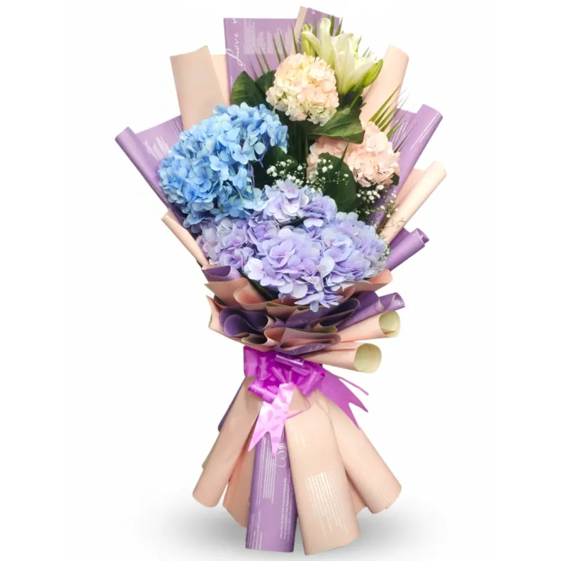 exotic blue purple and pink hydrangea bouquet with white lily in pastel wrap hyderabad delivery