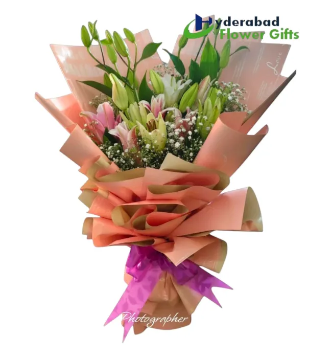 Premium pink and white lily bouquet with peach wrapping in Hyderabad